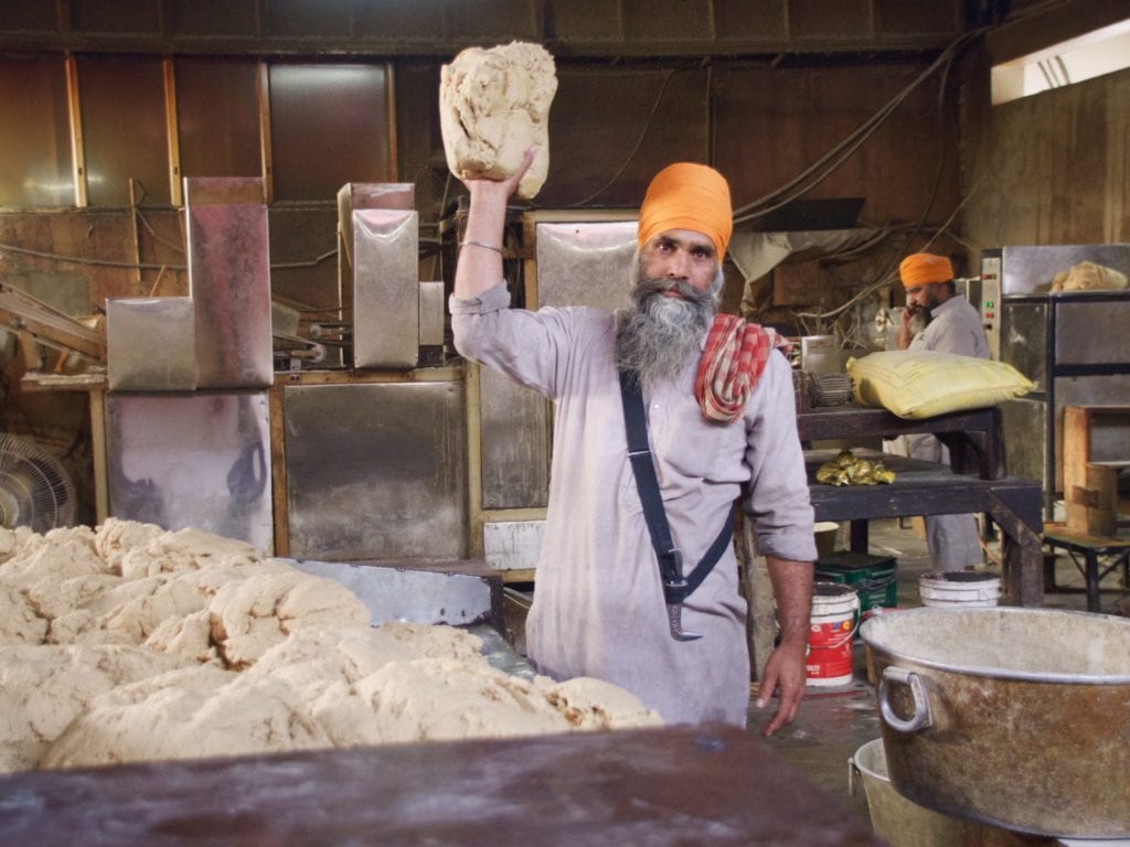 A Sikh making Chapati 