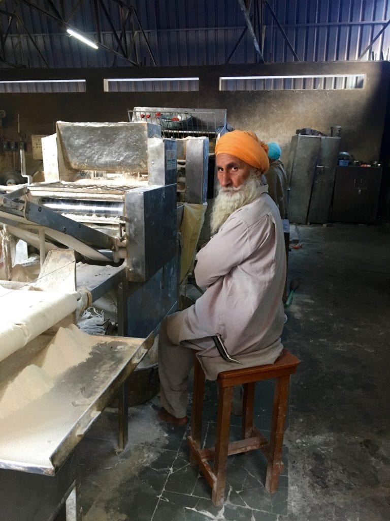 A Sikh making Chapati 