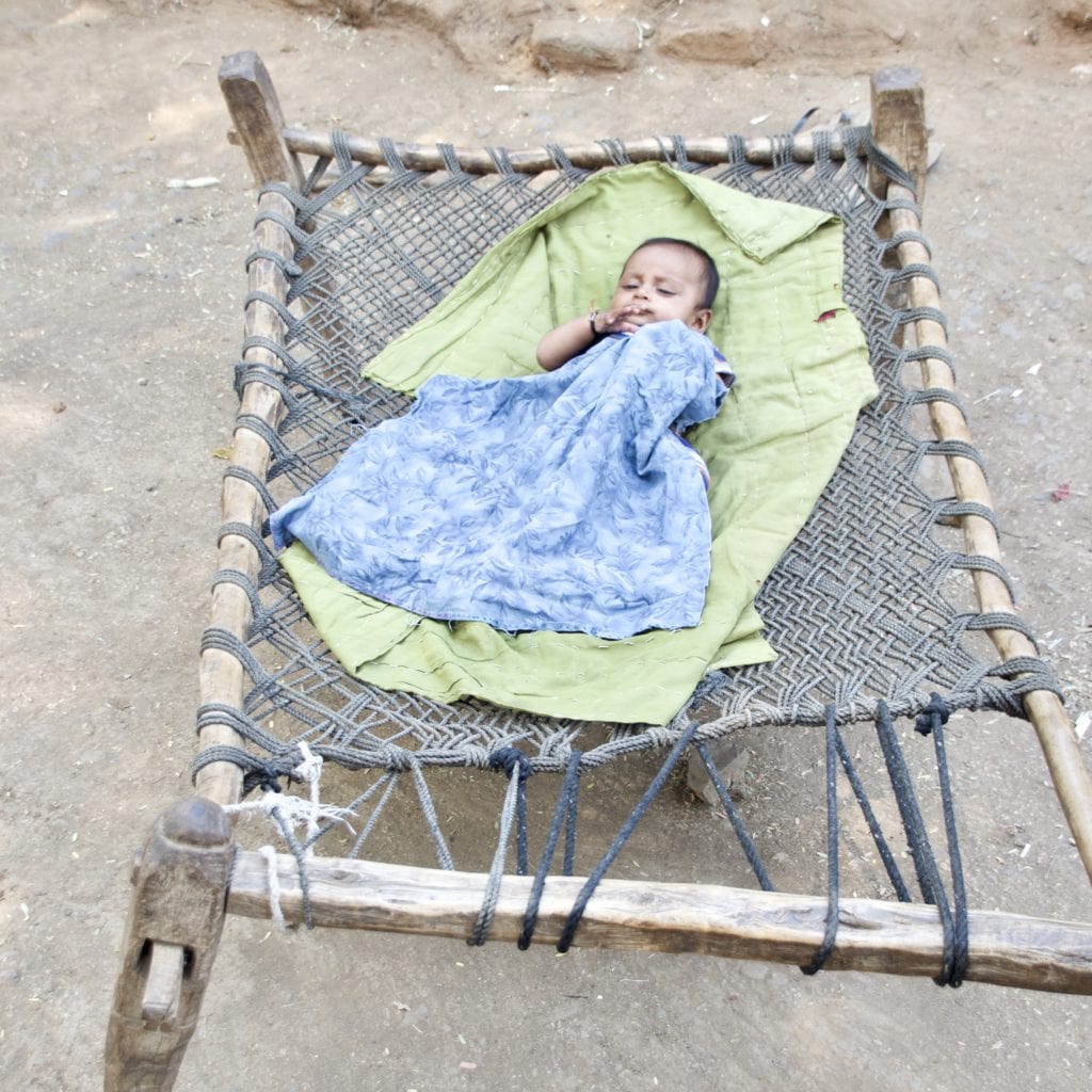 Baby taking a nap outside 