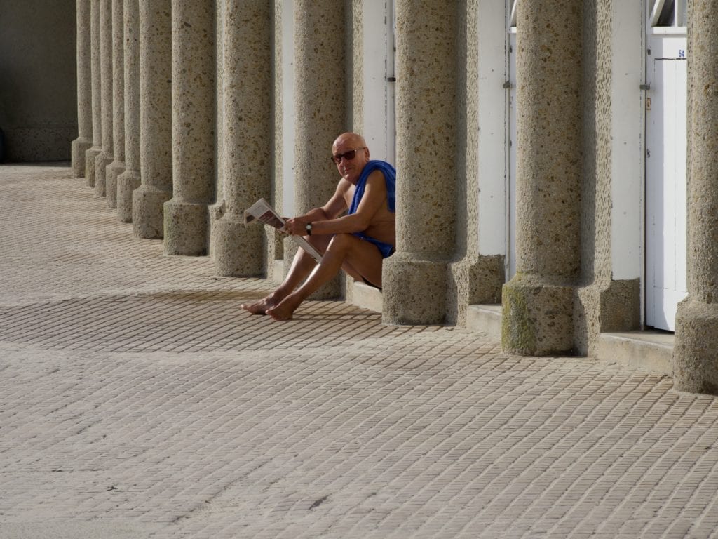 Reading newspaper after a swim Dinard 