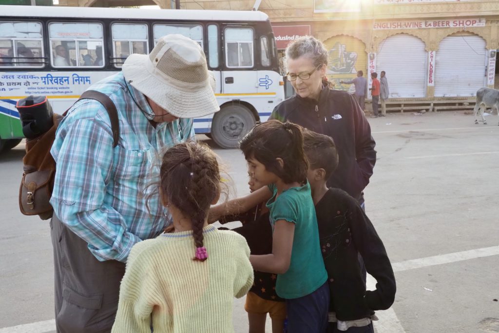 Hank giving candy to children 