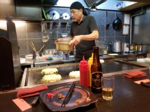  The restaurant chef in his (tiny!) work space by the counter.